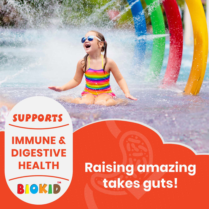 Happy child playing in water with GutScribe BioKid probiotic benefits for immune and digestive health supporting kids' wellness