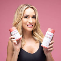 Woman holding Femina™ Cookie Fresh boric acid suppositories for intimate health and freshness