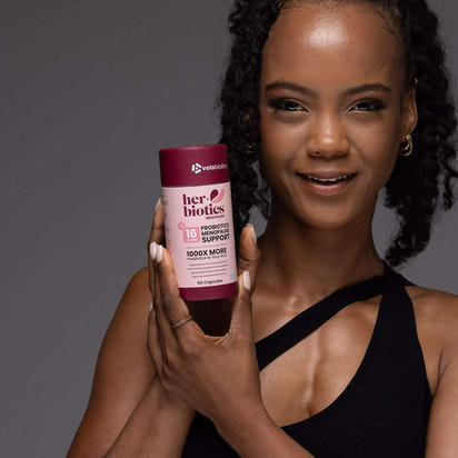 Her-Biotics Probiotics Menopausal Support supplement bottle with herbal extracts and probiotics for hormonal balance and bone health