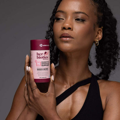 Her-Biotics Probiotics Menopausal Support supplement bottle with herbal and nutrient blend for hormonal balance and bone health