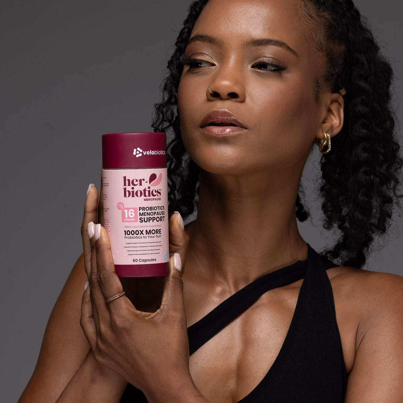 Her-Biotics Probiotics Menopausal Support supplement bottle with herbal and nutrient blend for hormonal balance and bone health